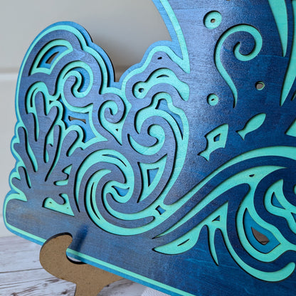 Vue de profil de la décoration baleine en bois, effet 3D