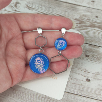 Éclat Céleste – Boucles d'Oreilles regan Plume aux Reflets Changeants