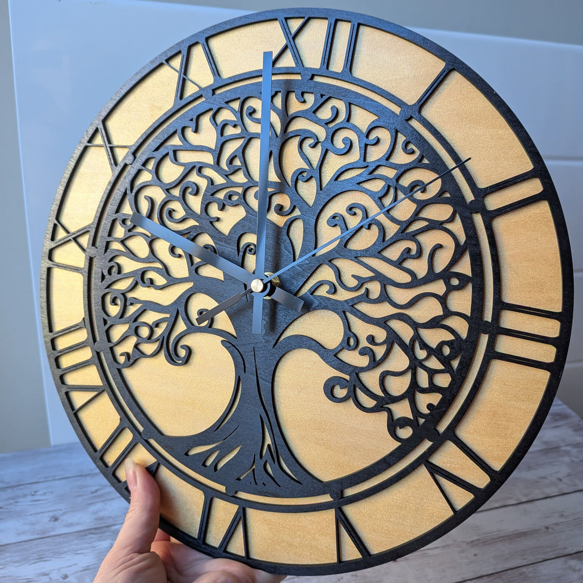 Horloge murale Arbre de Vie artisanale en bois noir et doré