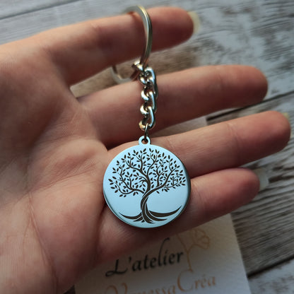 Porte-clé rond en acier inoxydable poli miroir avec gravure de précision d'un Arbre de Vie et texte personnalisé au verso.